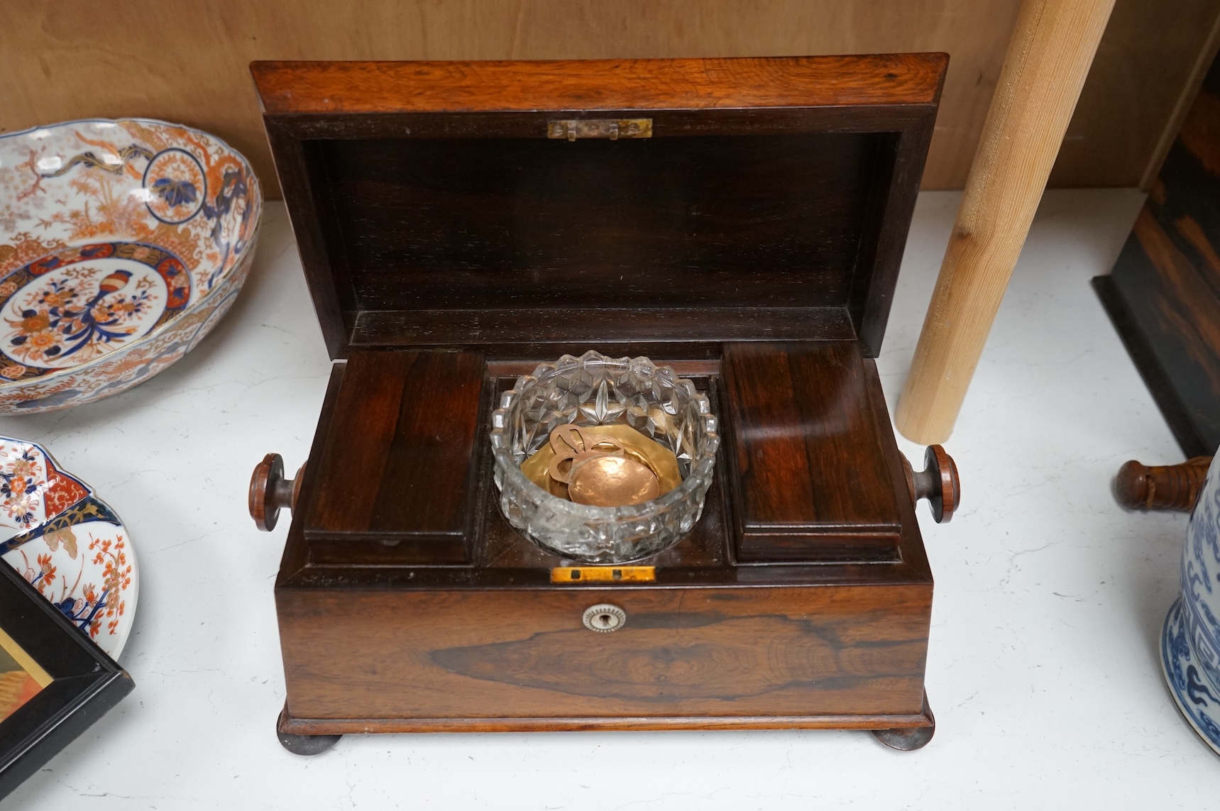 An early 19th century rosewood sarcophagus tea caddy, 39cm wide